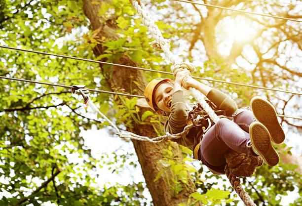 girl having fun in outdoors adventure park