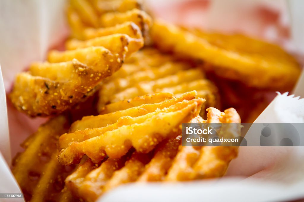 Waffle Fries Waffle Fries in Basket French Fries Stock Photo