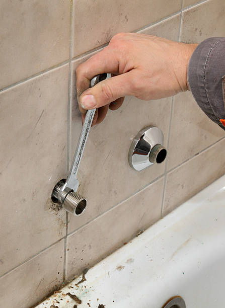 istock Plumber works in a bathroom 476109360