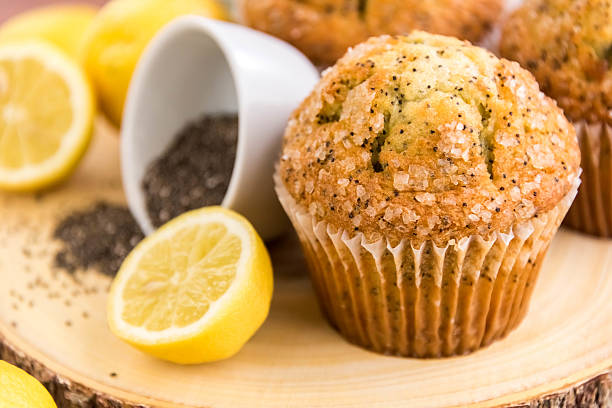 fresh baked lemon poppyseed muffins fresh baked lemon poppyseed muffins adn lemons and poppyseeds poppy seed stock pictures, royalty-free photos & images