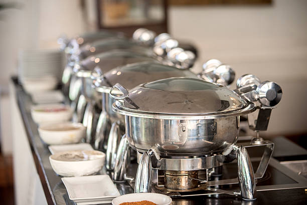 istock Buffet Table with Row of Food Service Steam Pans 476110506