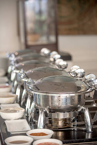 istock Buffet Table with Row of Food Service Steam Pans 476110518