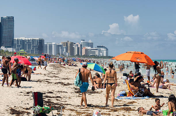 Young man taking pictures at South Beach, Miami