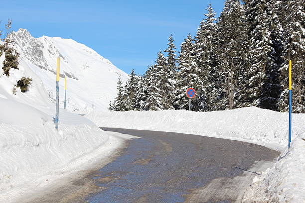 istock Black Aspahlt in a White Scenery, Zirmbach, Sellraintal, Tyrol, Austria 476111207