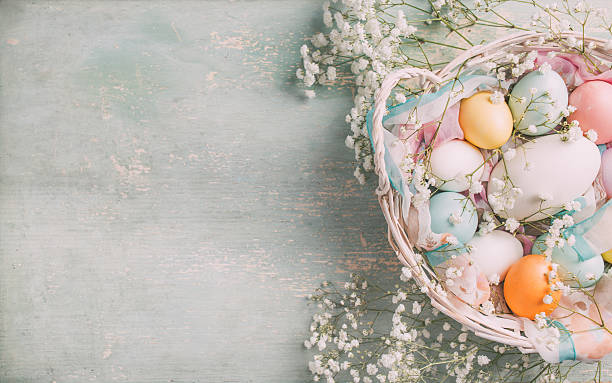 istock Easter eggs in pastel colors on a wooden table 476111266