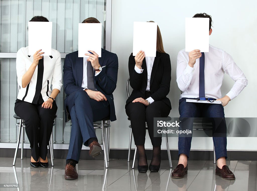 Human resource concept, Young businessman holding white billboar Human resource concept, Young businessman holding white billboard and waiting for job interview 2015 Stock Photo