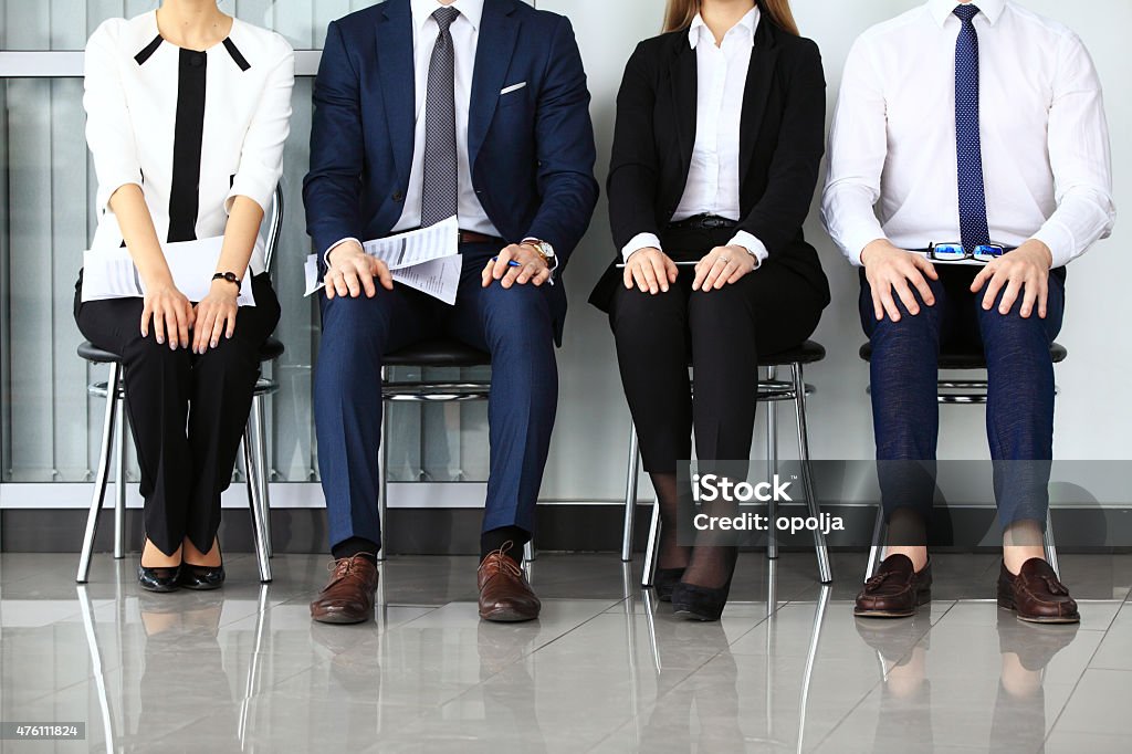 Business people waiting for job interview. Business people waiting for job interview. Four candidates competing for one position Interview - Event Stock Photo