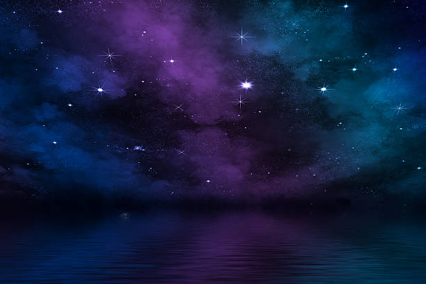 istock dramatic night sky over sea background with colorful nebula 476112676