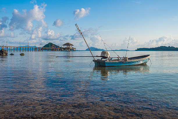 istock Single small boat floating on the sea 476114920