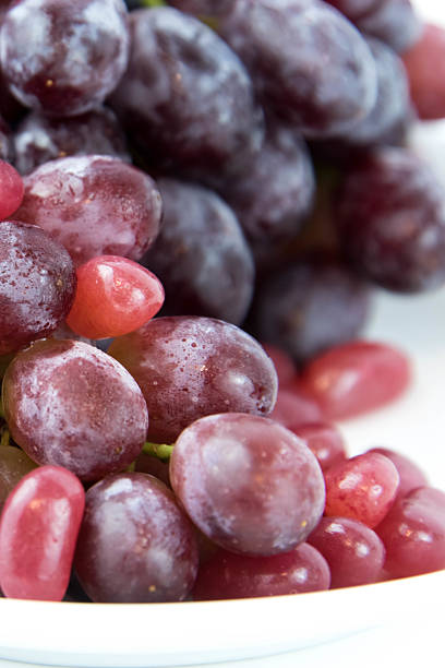 istock purple grapes vs purple jelly beans 476115422