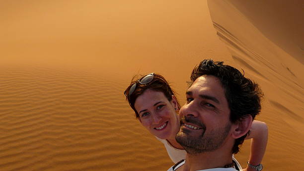 istock Young couple taking a self picture in the desert 476116458