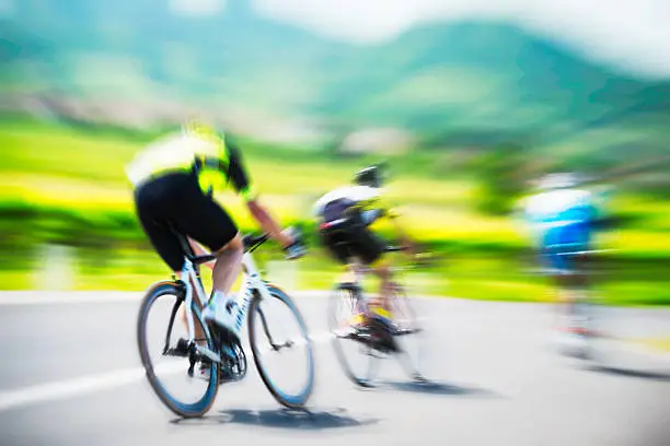 Action shot of a racing cyclists. 