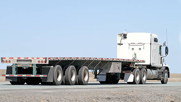 istock Semi Tractor Trailer Flatbed Truck With No Load On Highway 476117626