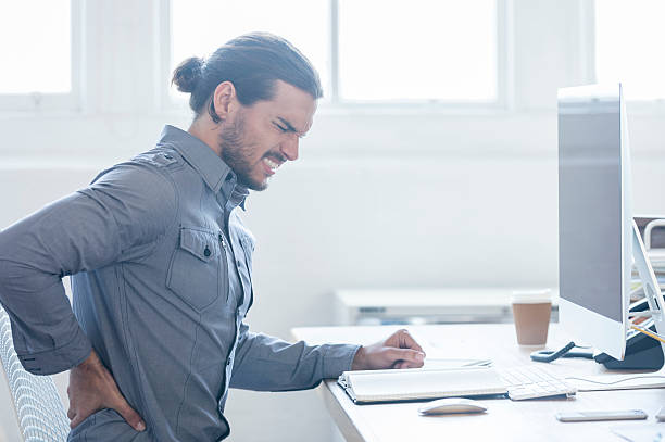 istock Young business man with holding his back in pain. 476118610
