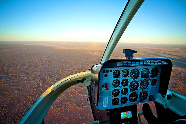 Helicopter Cockpit Flying over Desert Outback Australia stock photo
