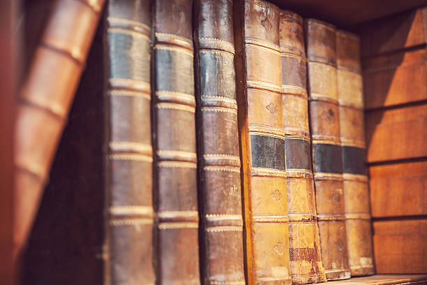 istock Rare and old First edition books on a bookshelf 476119096