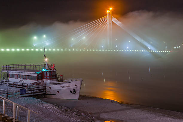 Rovaniemi, Finland - November 27, 2010: A boat on the river Kemijoki covered with ice at night.