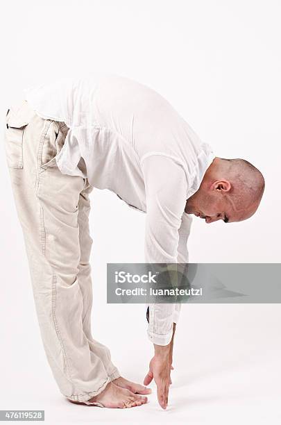 Man Relaxing And Stretching Flexibility Exercise Stock Photo - Download Image Now - 2015, Activity, Adult