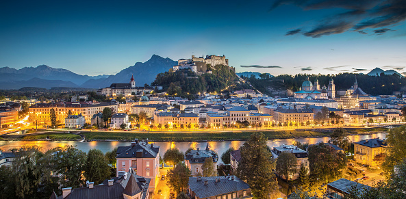 Panoramic view of the historic city of Salzburg with Hohensalzburg Fortress at dusk, Salzburger Land, Austria.