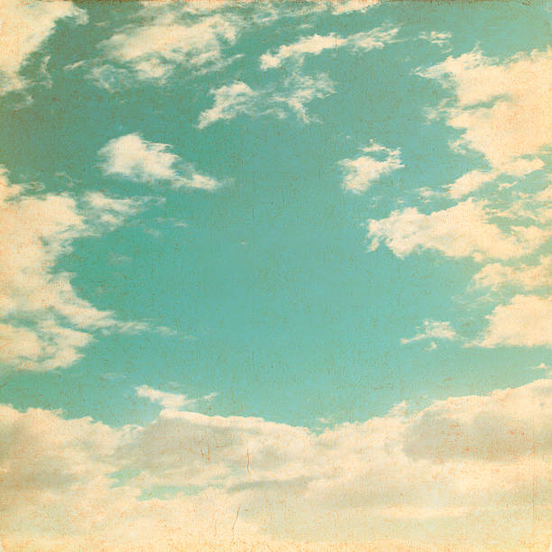 istock Old paper background with blue sky and white clouds 476124492