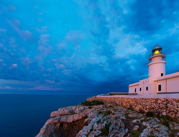 istock Menorca sunset at Faro de Caballeria Lighthouse 476125134