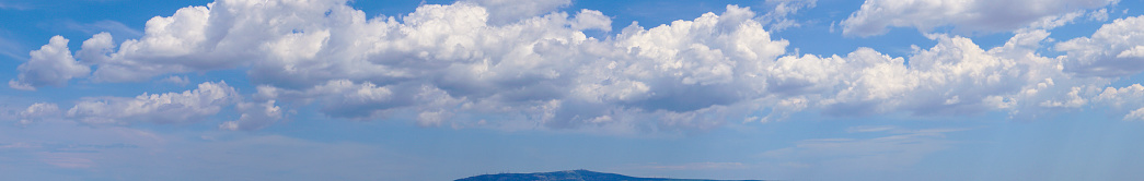 Panoramic picture of white clouds and blue skies. 