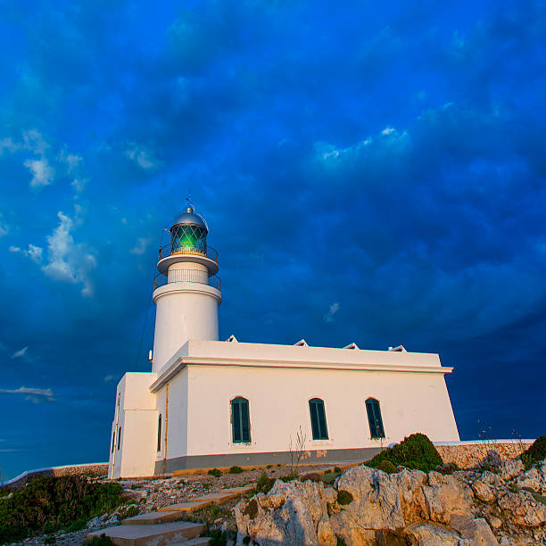 istock Menorca sunset at Faro de Caballeria Lighthouse 476125698