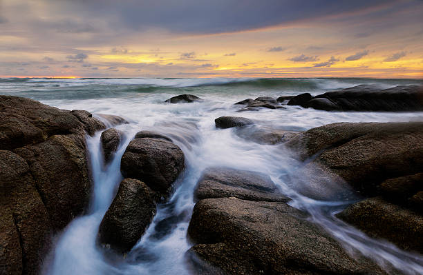 istock Evening light sunset sea waves splashing rocks. 476128140