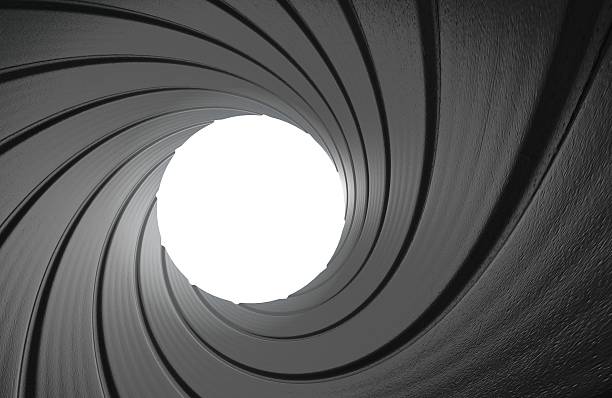 Gun barrel interior spy background in 3D Point of view from inside the spiraled metal chamber of a firearm, rendered in 3D. cannon artillery photos stock pictures, royalty-free photos & images