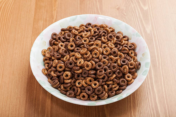 istock one dish of cereal breakfast without milk on woody table 476129914