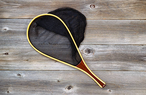 istock Landing net for fishing on rustic wood 476130564