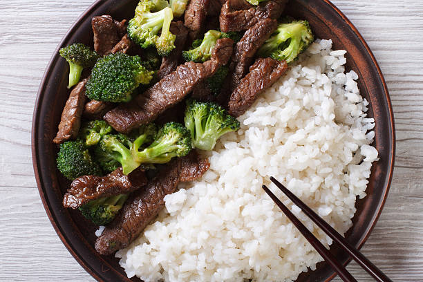 istock beef with broccoli and rice close-up. horizontal top view 476130996