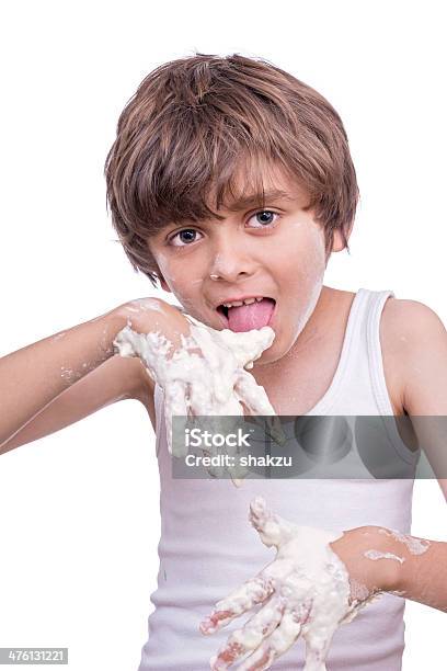 Giovane Baker - Fotografie stock e altre immagini di Bambino - Bambino, Gesso da costruzione, Leccare