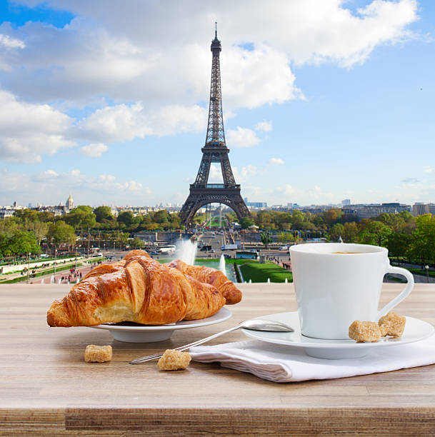istock cup of coffee with croissant in Paris 476131448