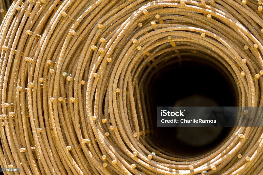 Roll of rusty steel wire mesh for construction. Roll of rusty steel wire mesh for construction or fence. Structural steel for concrete walls. Background 2015 Stock Photo