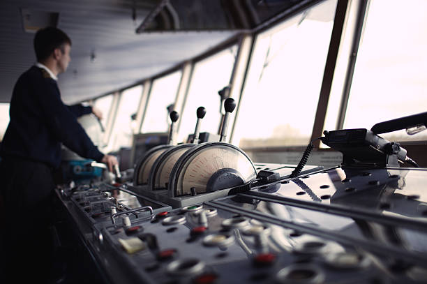 Navigation officer driving ship on the river. Navigation officer driving the ship on the river. military ship photos stock pictures, royalty-free photos & images