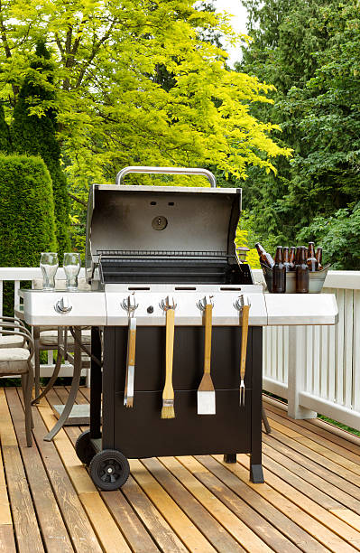 istock BBQ Cooker on cedar patio ready to use 476136202