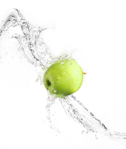 istock Green apple with water splash, isolated 476139710