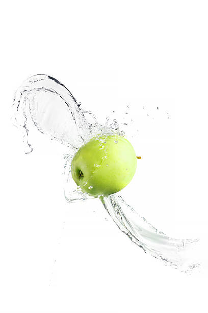 istock Green apple with water splash, isolated 476139714