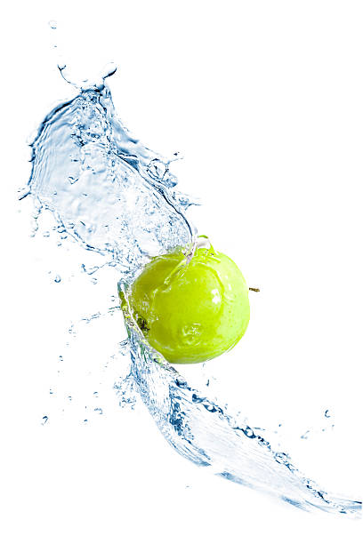 istock Green apple with water splash, isolated 476139716