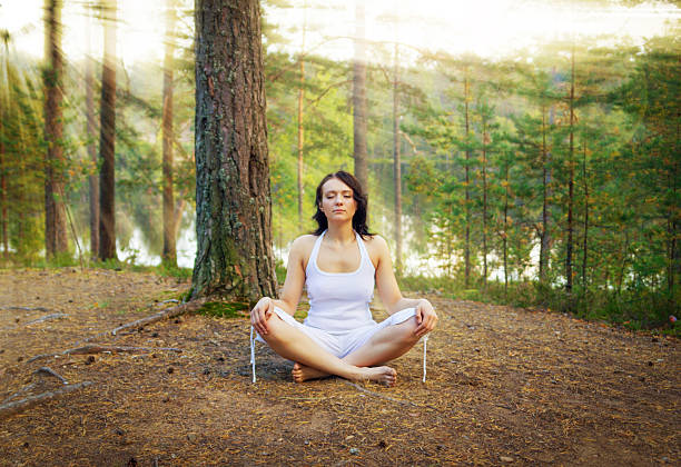 istock Woman meditate in the forest 476139932
