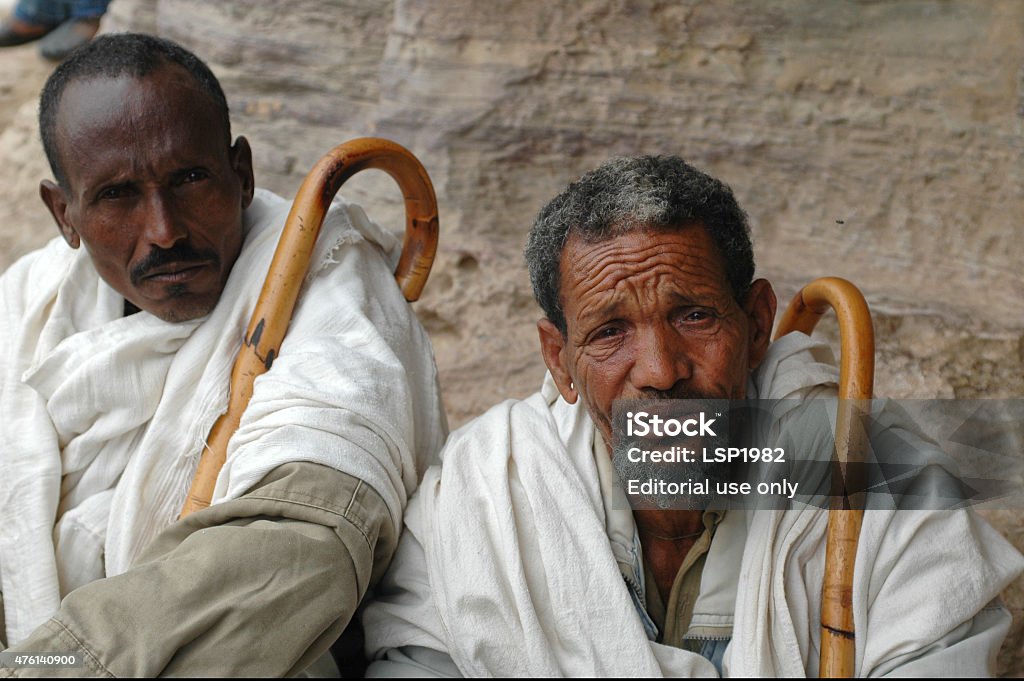 Portrait of Two Ethiopian men with walking sticks. Debre Damo, Ethiopia - September 23, 2006: Portrait of Two Ethiopian men with walking sticks at the foothills of Debre Damo Mountain church in the North of Ethiopia.  2015 Stock Photo