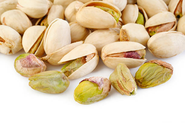 istock pistachio nuts isolated on white background 476144102