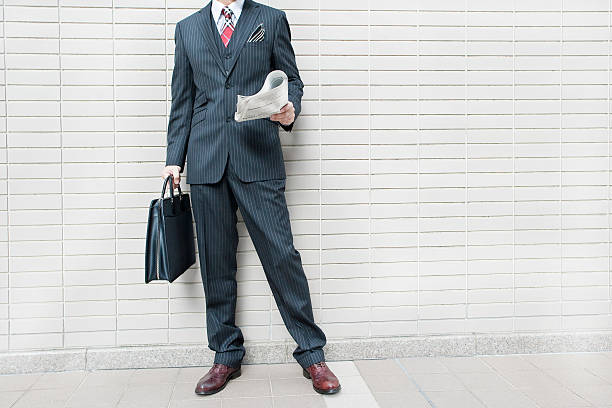 istock The businessman who reads a newspaper 476144519