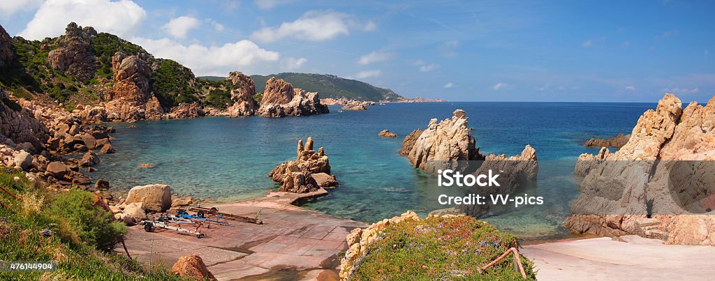 The rocky coast of Sardinia Typical clear water and red rocks on the north coast of Sardinia, Italy at Paradise Beach. 2015 Stock Photo