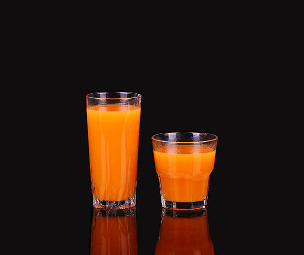istock Carrots and juice in a glass 476146460