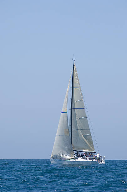 istock Sailboat Racing In The Blue Ocean Against Sky 476146529