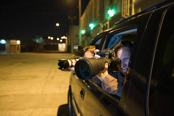 Paparazzi Photographer In Car