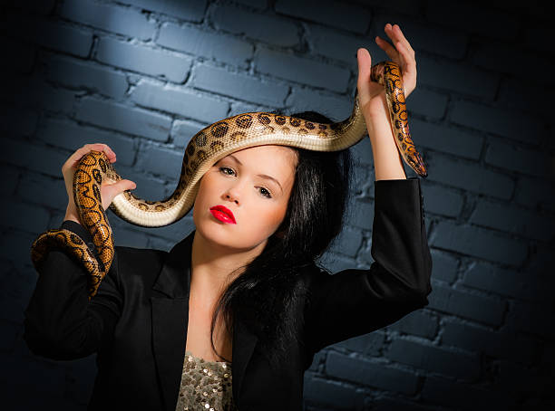 istock Woman and snake 476146897
