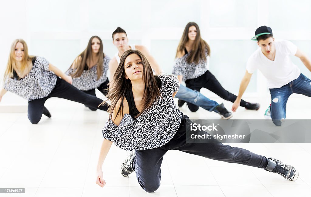 Teenagers dancing. Group of teenagers dancing in a dance studio.    Dance Troupe Stock Photo